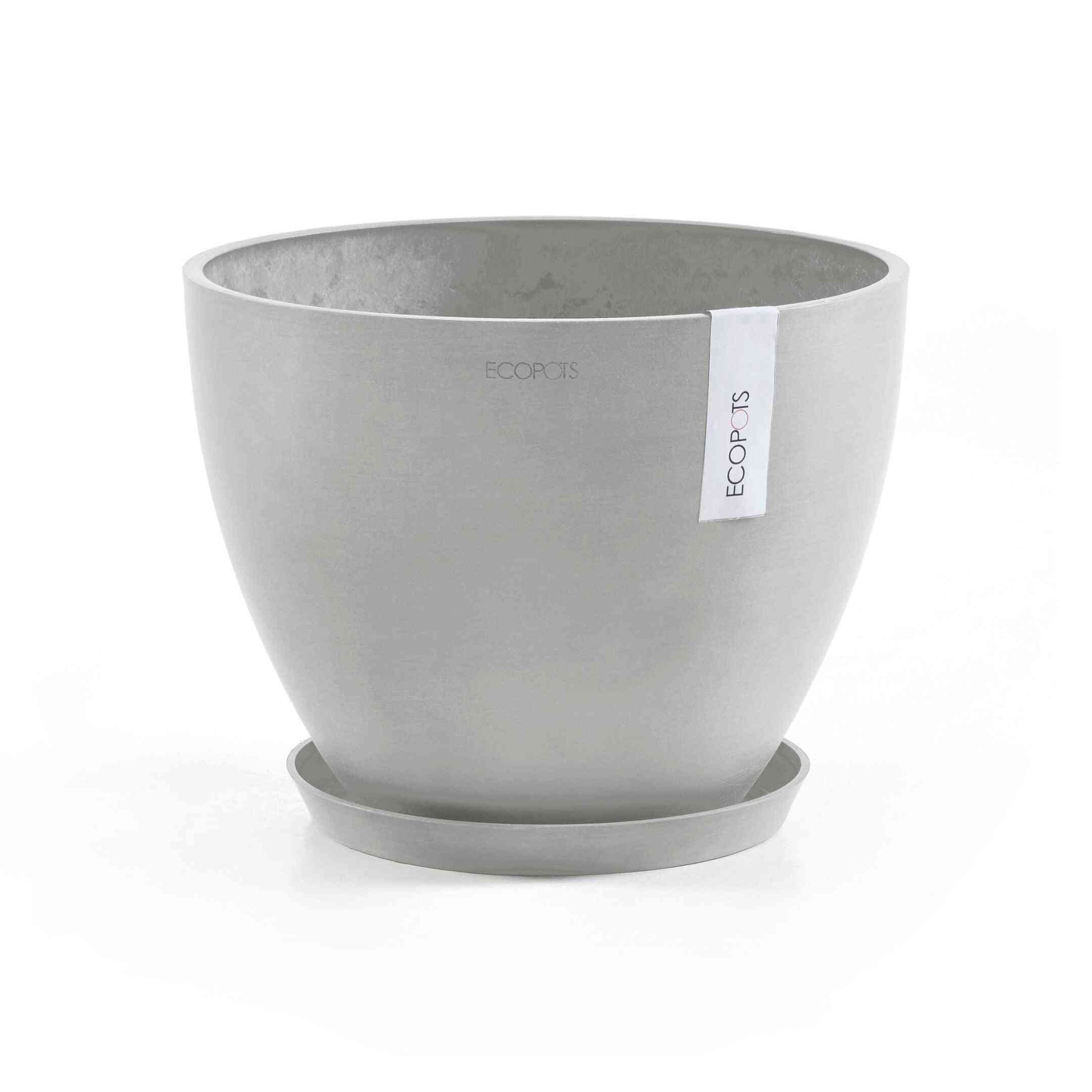 Кръгла чинийка Ecopots saucer round 25 White Grey под сива саксия – идеална за оттичане на вода при отглеждане на стайни растения.