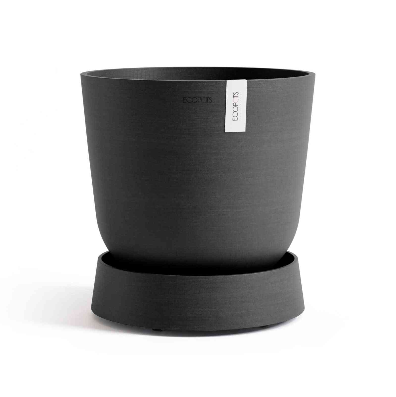 Кашпа Ecopots, поставена върху чинийка с колелца Saucer Wheels Oslo 35 Dark Grey, идеална за интериорна декорация.